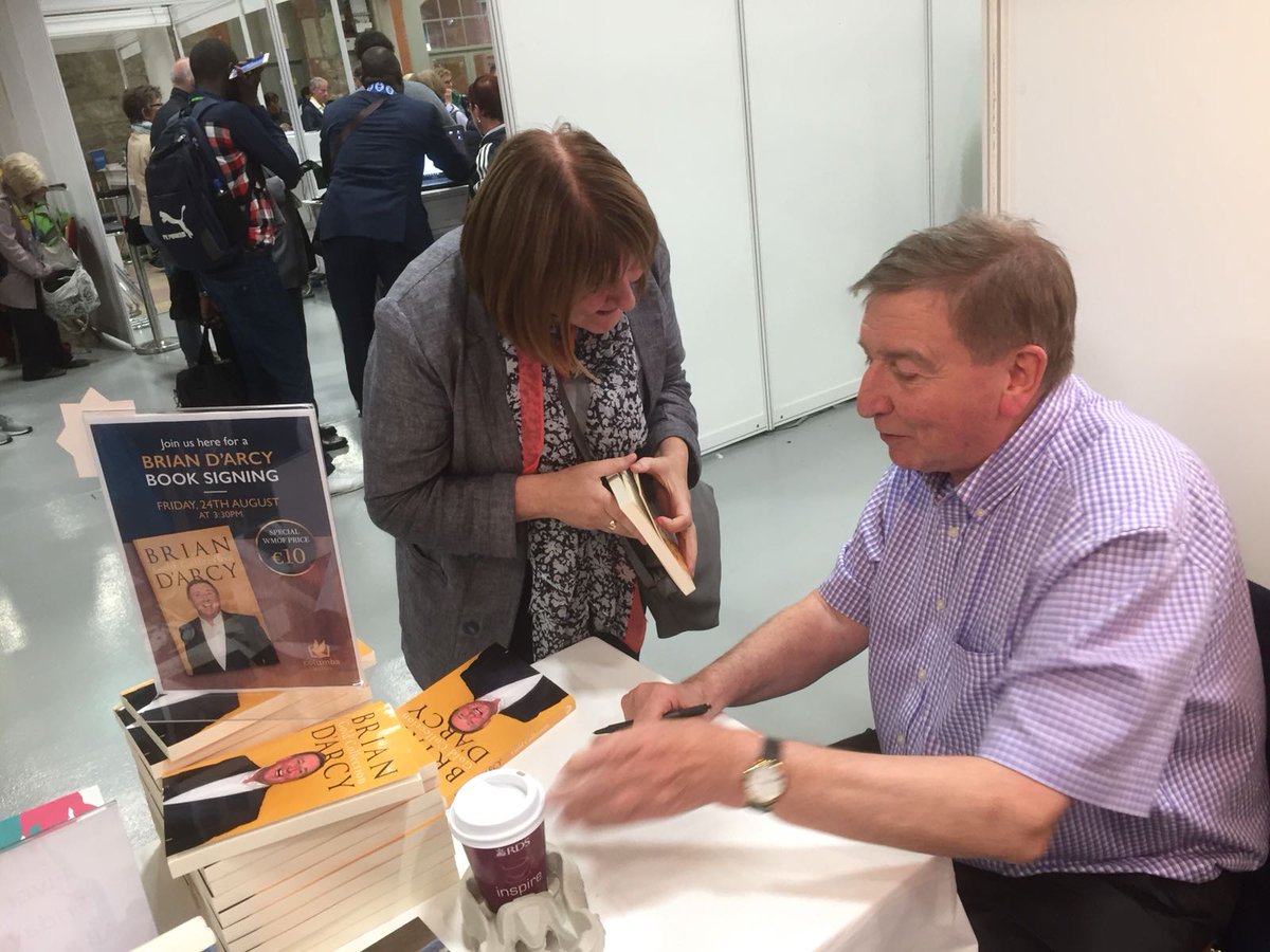 Fr Brian D'Arcy signing books at our WMOF stall
